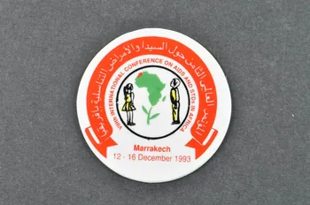 Viii° International Conference On Aids And Stds In badge Badge VIII° International Conference on AIDS and STDs in AFRICA Maroc 1993 2003.125.305 Photo Mucem