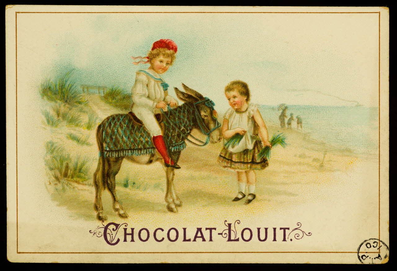 carte réclame Garçon à dos d'âne et fillette sur une plage 1942.26.500 Photo