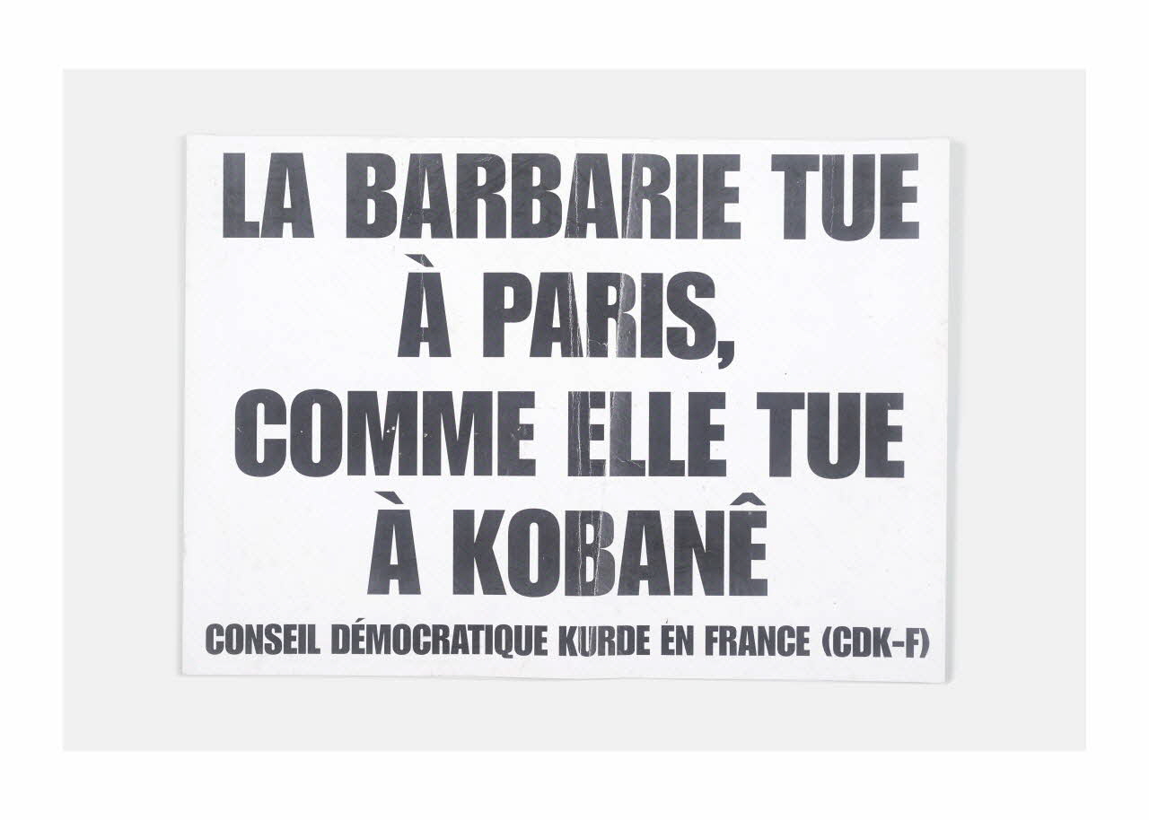 Conseil démocratique kurde en France affiche de récupération La barbarie tue à Paris, comme elle tue à Kobané Ile-de-France, France 2015/1/7 2015.9.1 Photo Mucem/ Yves Inchierman